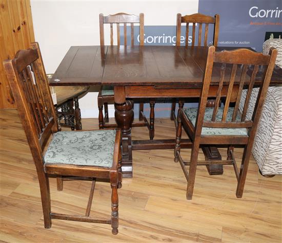 A 1920s oak draw leaf dining table and four chairs